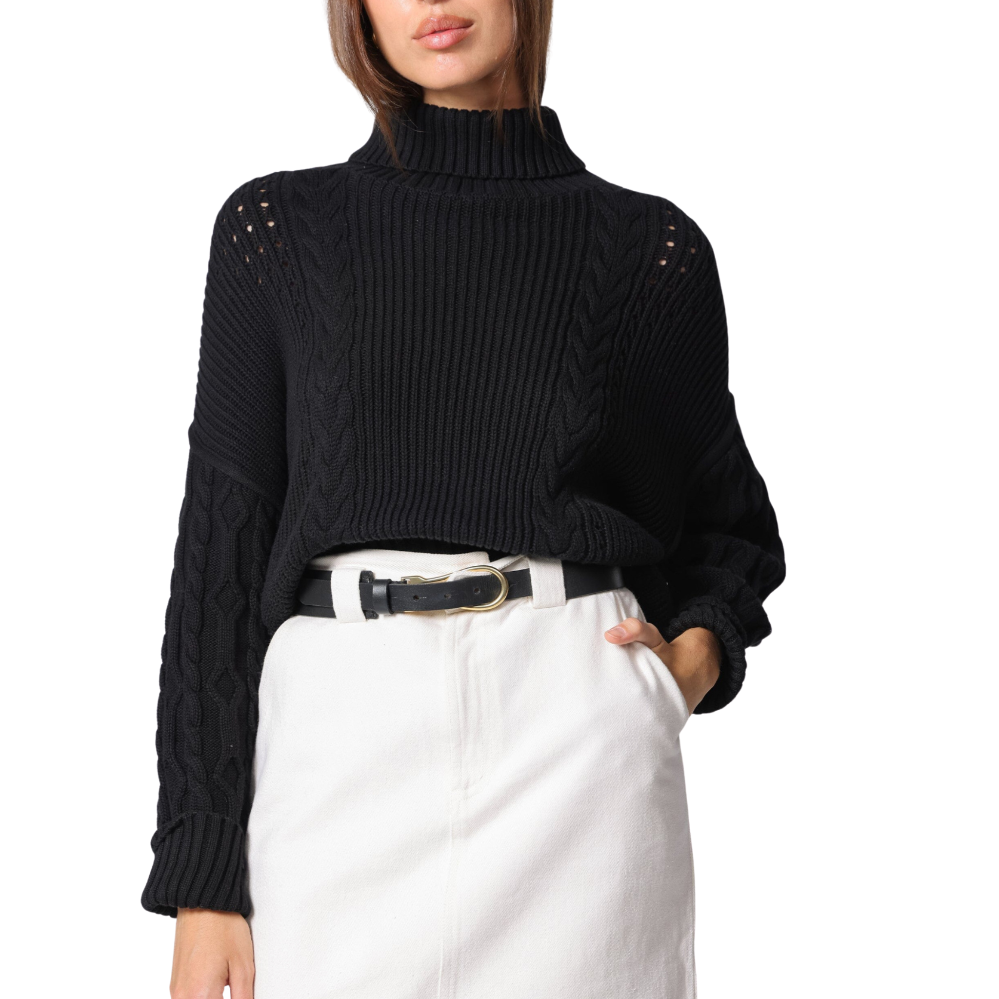 Black ribbed sweater with shoulder embellishments worn by a person on a white background